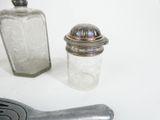 two salt and pepper shakers on a white table
