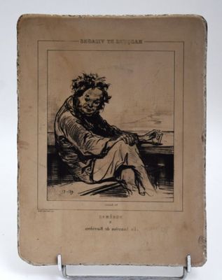 un vieux livre sur lequel figure le dessin d'un homme assis sur un banc