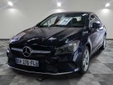 the mercedes cla is parked on a checkered floor in a garage