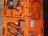 two orange boxes with tools in them on the floor