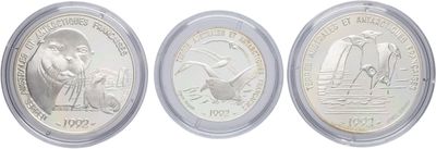 three different types of silver coins in a clear plastic case