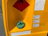 a yellow fire hydrant that has a red hazard sign on it