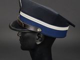 a black mannequin head with a blue hat on it