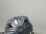 a silver object that is sitting on a table
