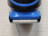 an image of a close up of a blue and black shaver