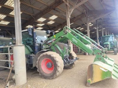 a tractor that is parked inside of a building