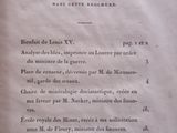 an open book with a black and white image of a table