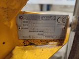 a label on the back of a machine that is sitting on the ground
