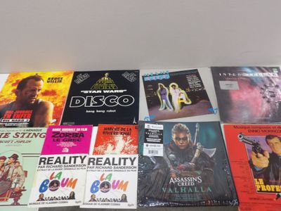 many movie posters on the wall of a room