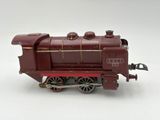 a toy train on a white surface with a white background