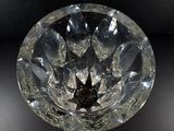 a crystal bowl with a star in it on a table