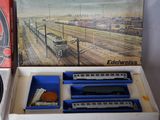 a box with a train set in it on a table