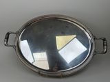 a silver tray with a mirror on top of it