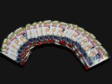 a fan of pokemon trading cards on a black background