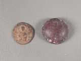 two coins sitting next to each other on a table