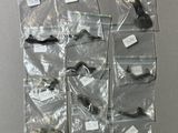 several bags of assorted items hang on a wall in a room