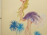dessin humoristique représentant une femme avec une autruche sur une plage