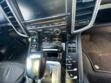 a close up of a car ' s interior with a steering control