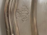 a silver plate with a decorative design on it