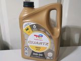 a bottle of quartz oil sitting on a table