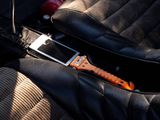 a car seat belt with a wrenet attached to it
