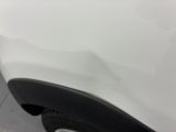 a close up of a white car with a black rim
