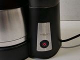 a coffee maker and a coffee pot on a table