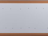 a white board on the wall next to a window