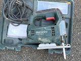 a tool that is sitting in a case on the ground