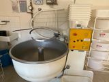 an image of a kitchen with a mixer and other items