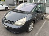 a picture of a small black car parked in a parking lot