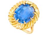 a close up of a ring with a blue stone in it