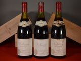 three bottles of wine sitting next to each other on a table