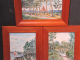 three framed paintings of boats on the water and trees on the shore