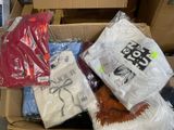 a box full of t - shirts and other items in it
