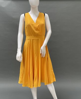 an image of a mannequin wearing a yellow dress on a mannequin mannequin