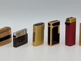a lot of different types of lighters on a white surface