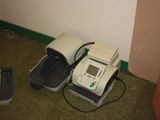 two phones that are sitting on the floor next to each other