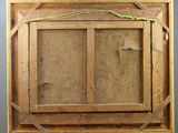 an old wooden easel with a painting hanging on it ' s side