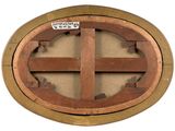 a wooden circular window with a sign on it