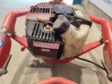 a close up of a small engine on a red bike
