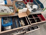 many boxes of assorted tools on a table