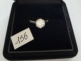 a close up of a diamond ring in a black box with a price tag