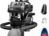 a close up of a vacuum cleaner and other cleaning supplies on a white background