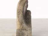 an image of a sculpture of a woman ' s head on top of a stone block