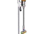 a close up of a vacuum cleaner on a stand on a white surface