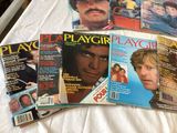 a lot of magazines on a bed with a man on it