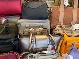 a lot of bags on a table in a store