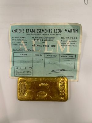 an image of a piece of gold sitting on top of a piece of paper