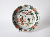 a plate with a picture of a woman and a man on it